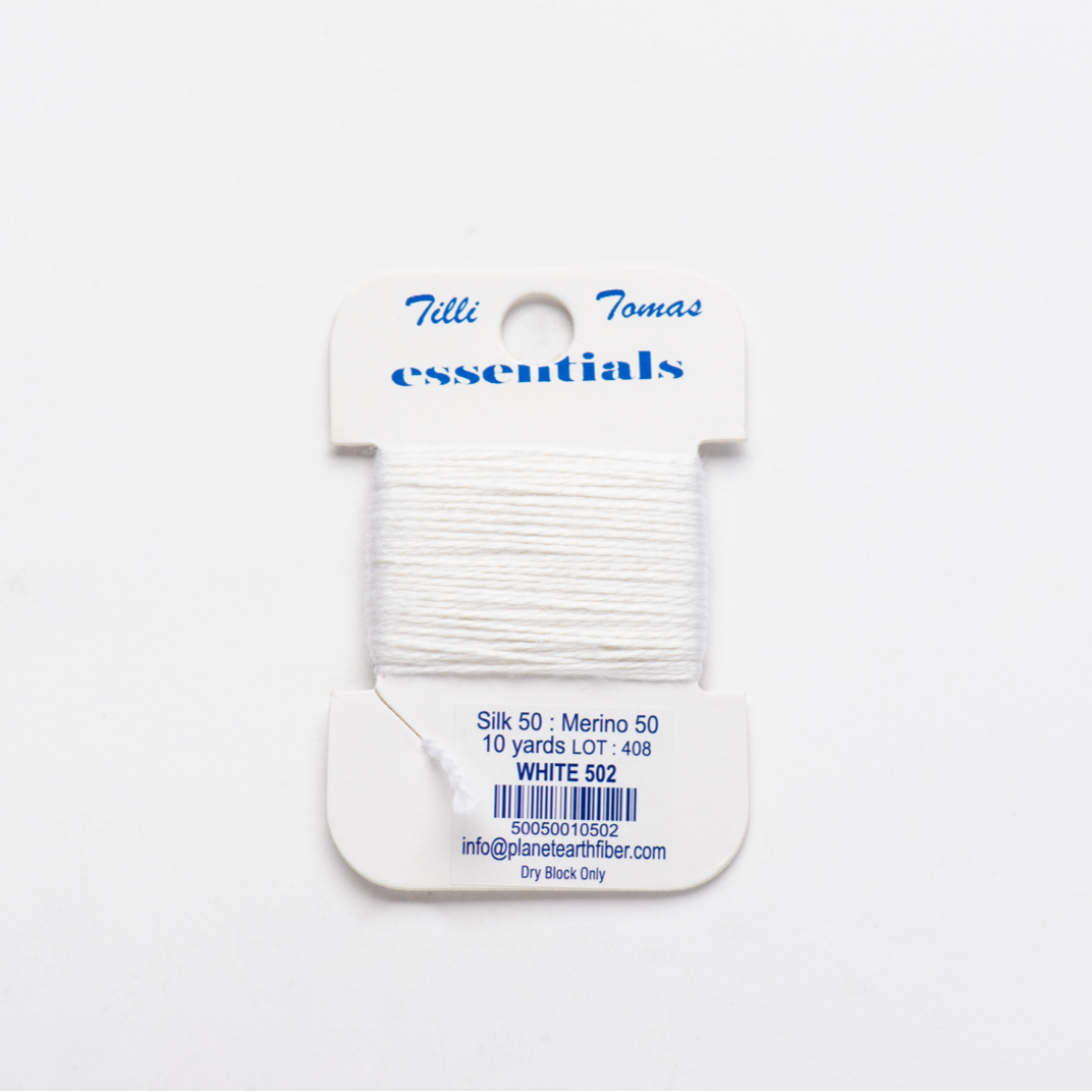 Card of white yarn with &